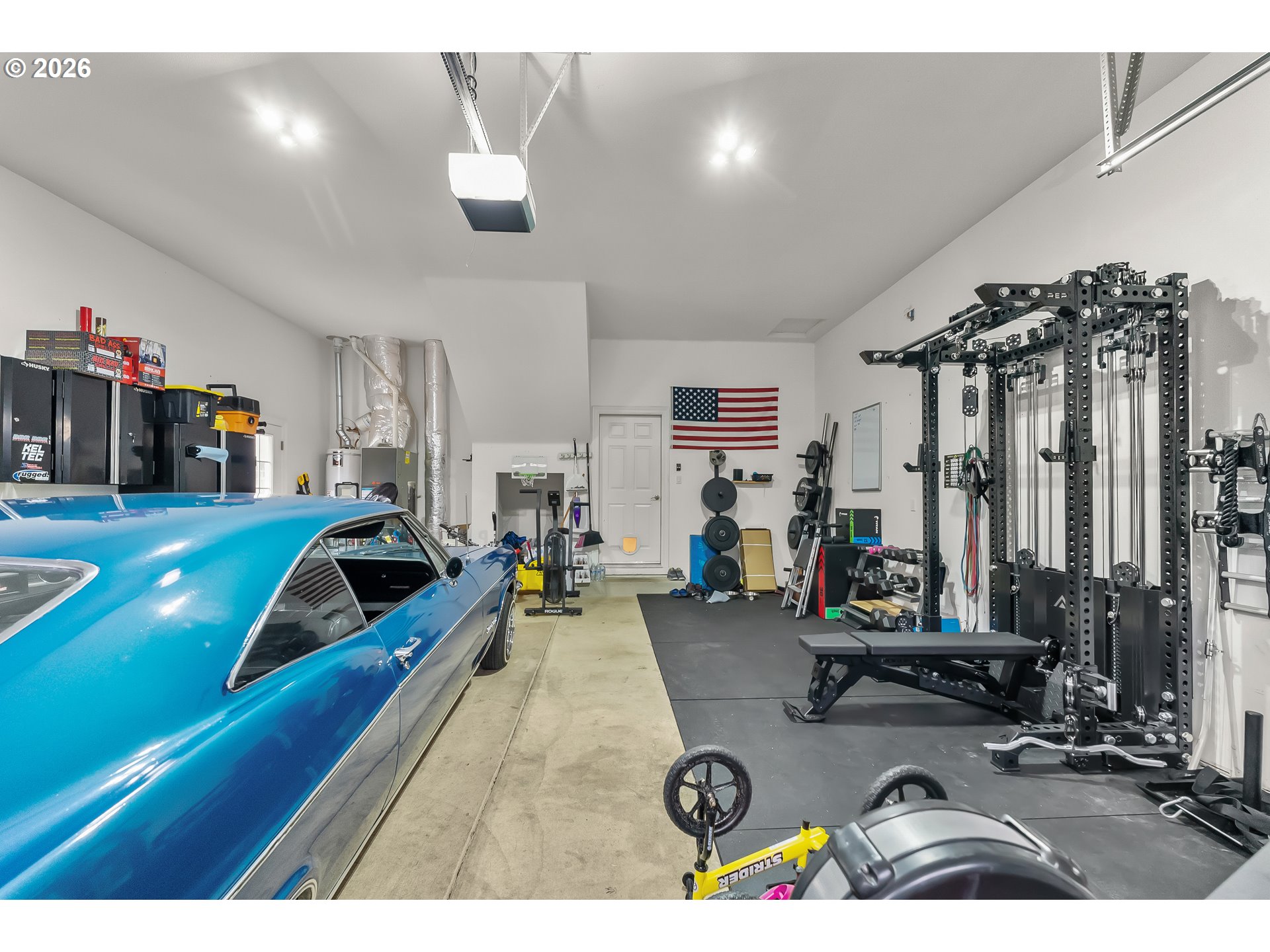 554 Oak Valley Loop Winchester, OR 97495 - Photo 34 of 42 a living room with furniture gym equipment and a large window
