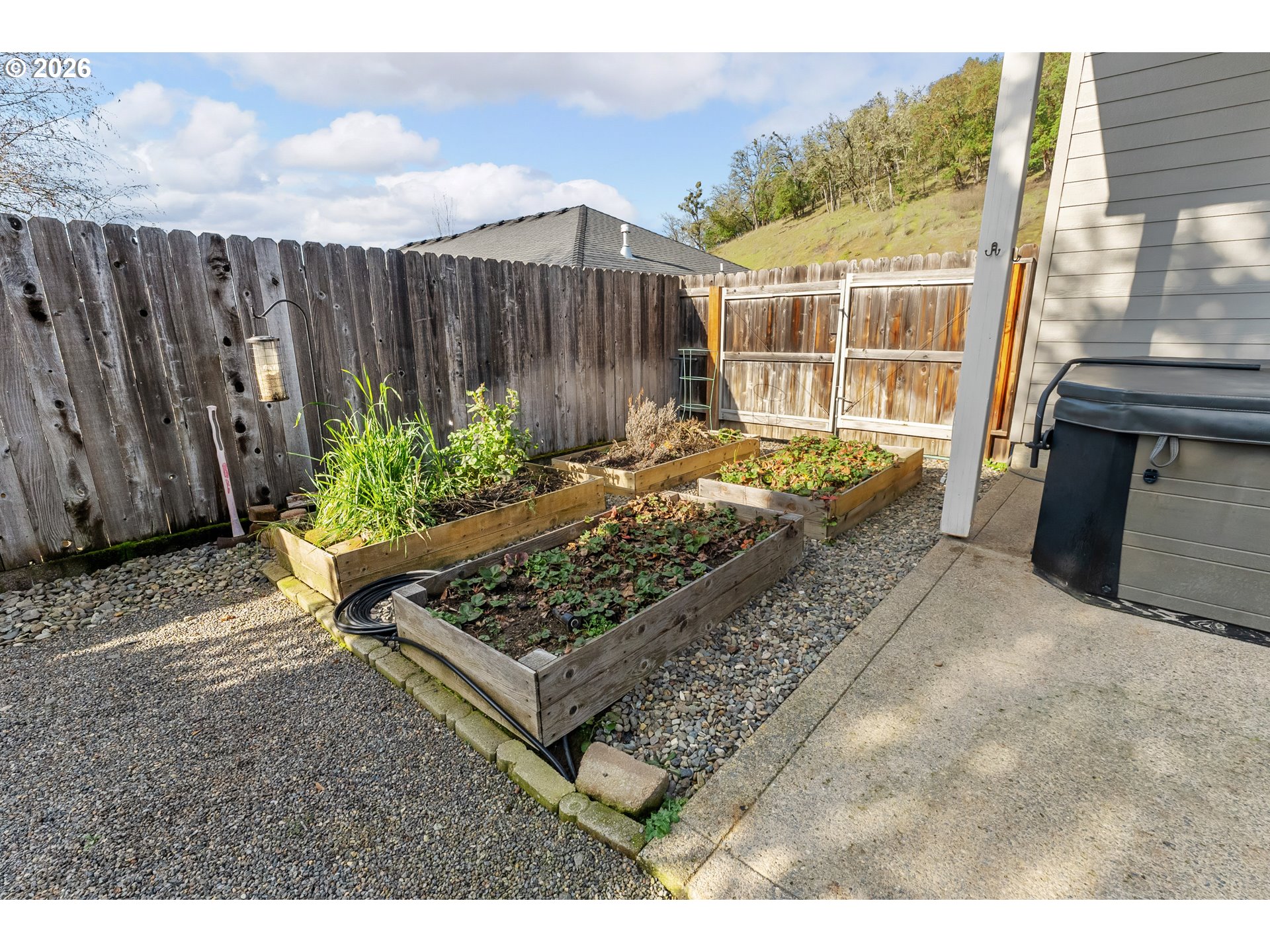 554 Oak Valley Loop Winchester, OR 97495 - Photo 35 of 42 a view of a backyard with wooden fence