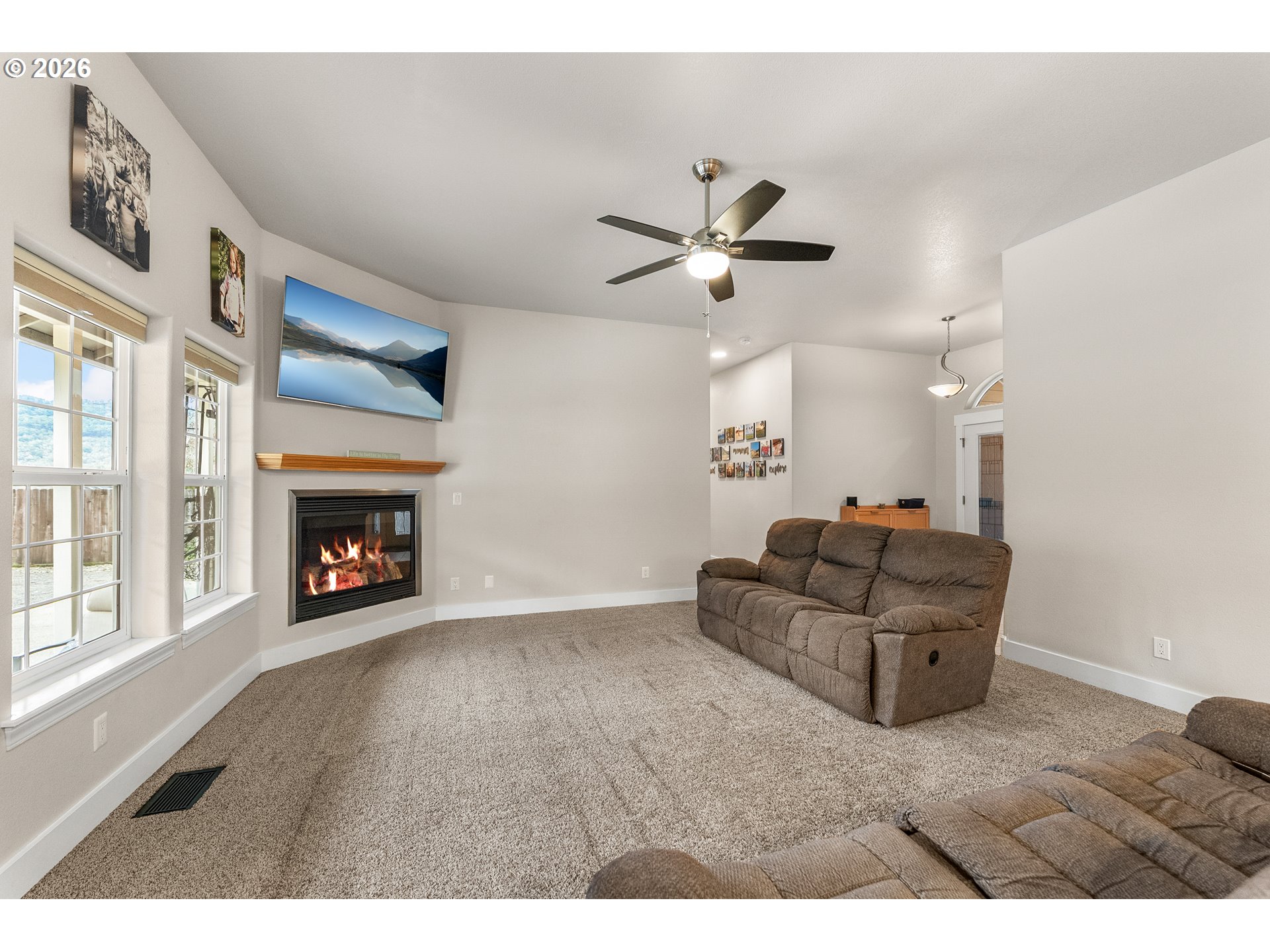 554 Oak Valley Loop Winchester, OR 97495 - Photo 7 of 42 a living room with furniture and a fireplace