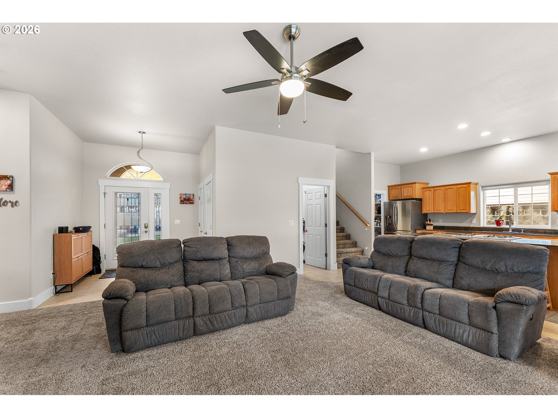 554 Oak Valley Loop Winchester, OR 97495 - Photo 8 of 42 a living room with furniture and a ceiling fan