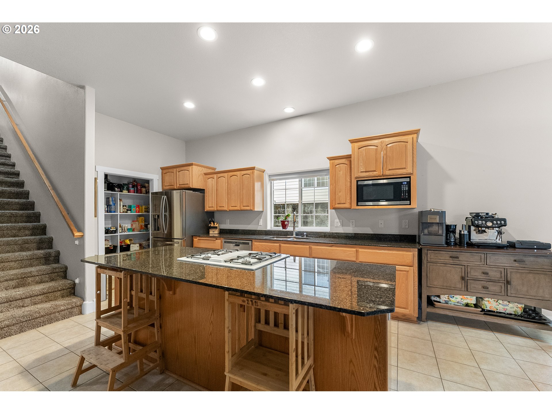 554 Oak Valley Loop Winchester, OR 97495 - Photo 10 of 42 a kitchen with stainless steel appliances granite countertop a sink and cabinets