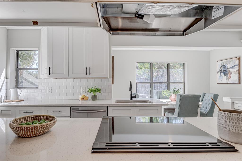 900 Highway 630 East Frostproof, FL 33843 - Photo 16 of 56 a kitchen with a dining table and chairs