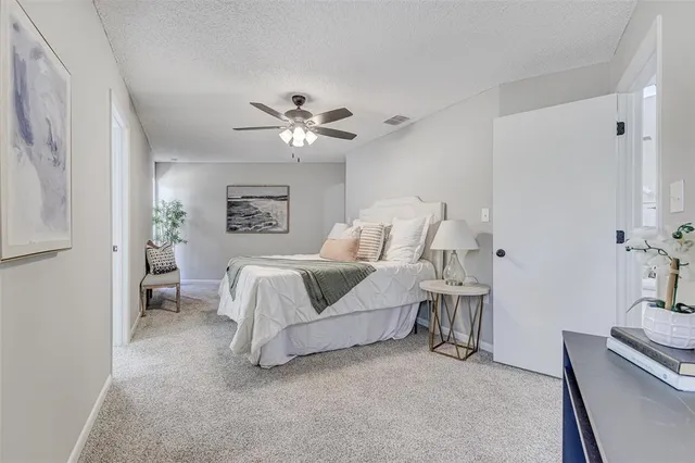 a bedroom with furniture and a chandelier