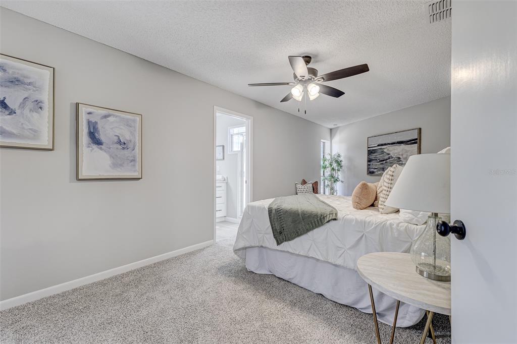 900 Highway 630 East Frostproof, FL 33843 - Photo 18 of 56 a bedroom with furniture and a chandelier