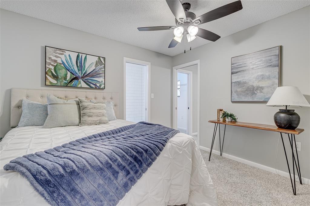 900 Highway 630 East Frostproof, FL 33843 - Photo 25 of 56 a bedroom with a bed and a chandelier