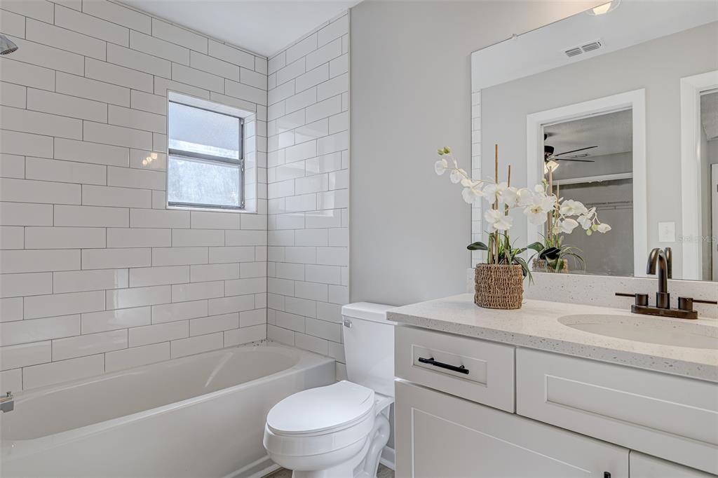 900 Highway 630 East Frostproof, FL 33843 - Photo 31 of 56 a bathroom with a sink a toilet and shower