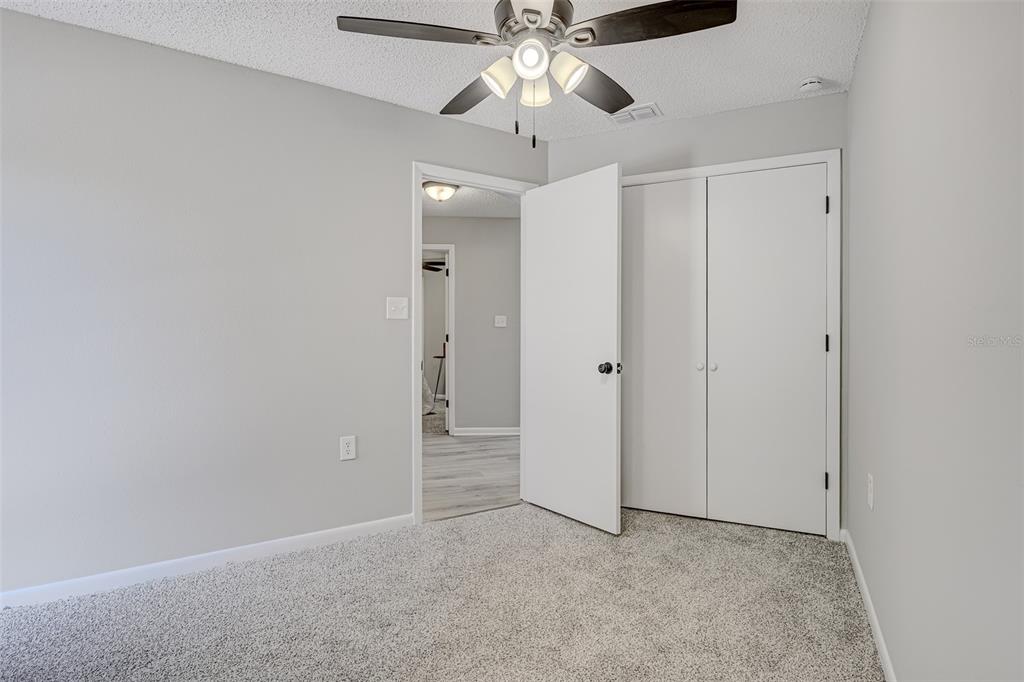 900 Highway 630 East Frostproof, FL 33843 - Photo 35 of 56 a view of an empty room and chandelier fan