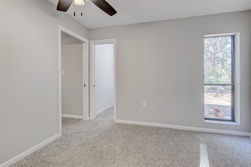 900 Highway 630 East Frostproof, FL 33843 - Photo 36 of 56 an empty room with windows and closet