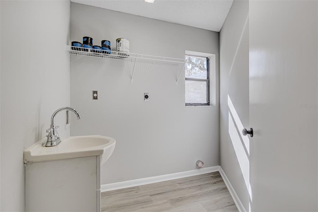 900 Highway 630 East Frostproof, FL 33843 - Photo 39 of 56 a bathroom with a sink and mirror