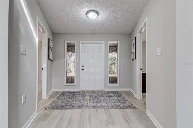 wooden floor in a hall with an entryway