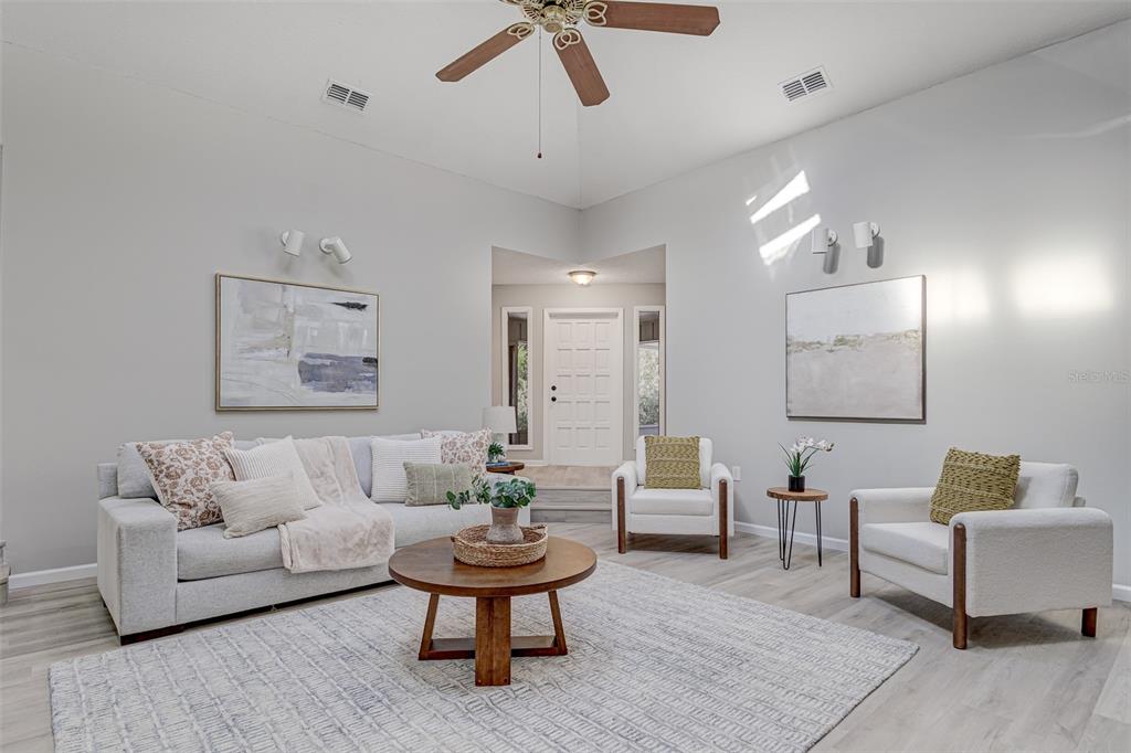 900 Highway 630 East Frostproof, FL 33843 - Photo 6 of 56 a living room with furniture and a potted plant