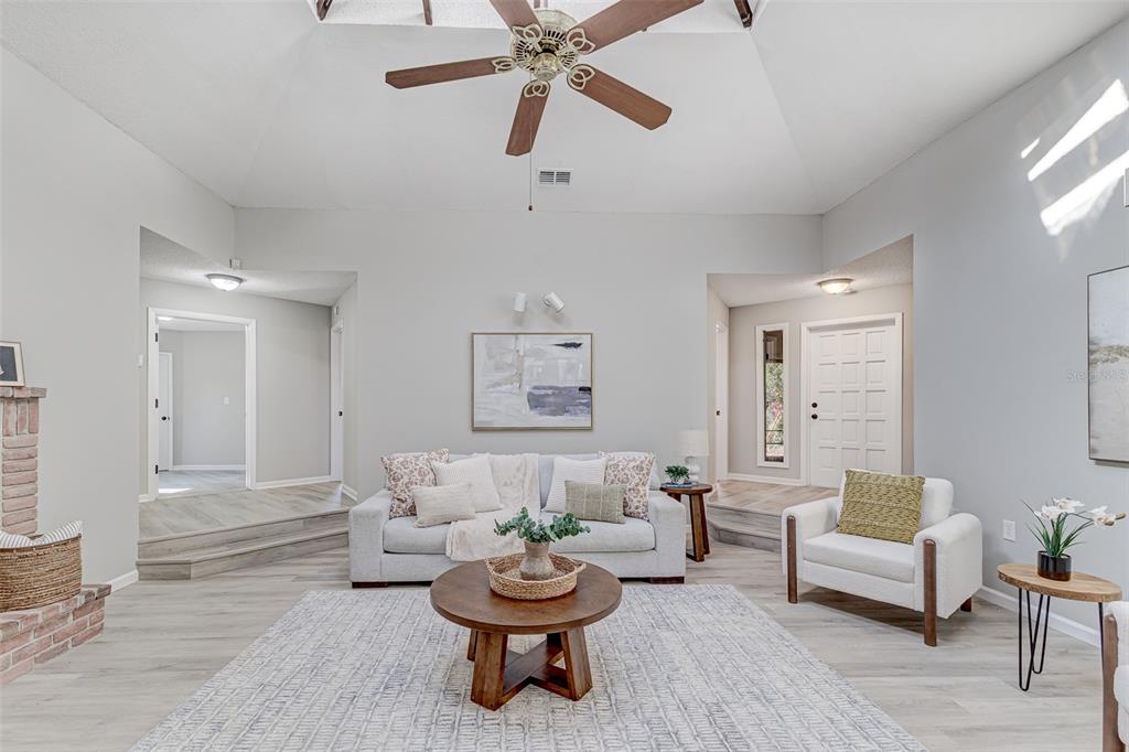 900 Highway 630 East Frostproof, FL 33843 - Photo 7 of 56 a living room with furniture and a wooden floor