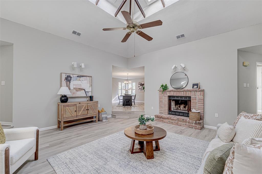 900 Highway 630 East Frostproof, FL 33843 - Photo 9 of 56 a living room with furniture and a fireplace