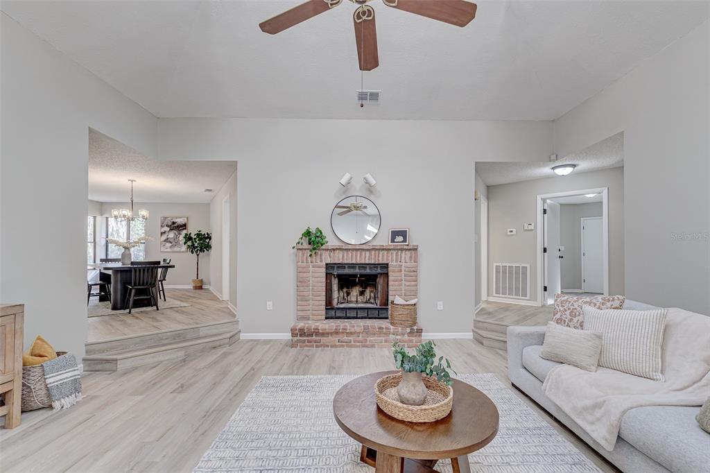 900 Highway 630 East Frostproof, FL 33843 - Photo 10 of 56 a living room with furniture and a fireplace