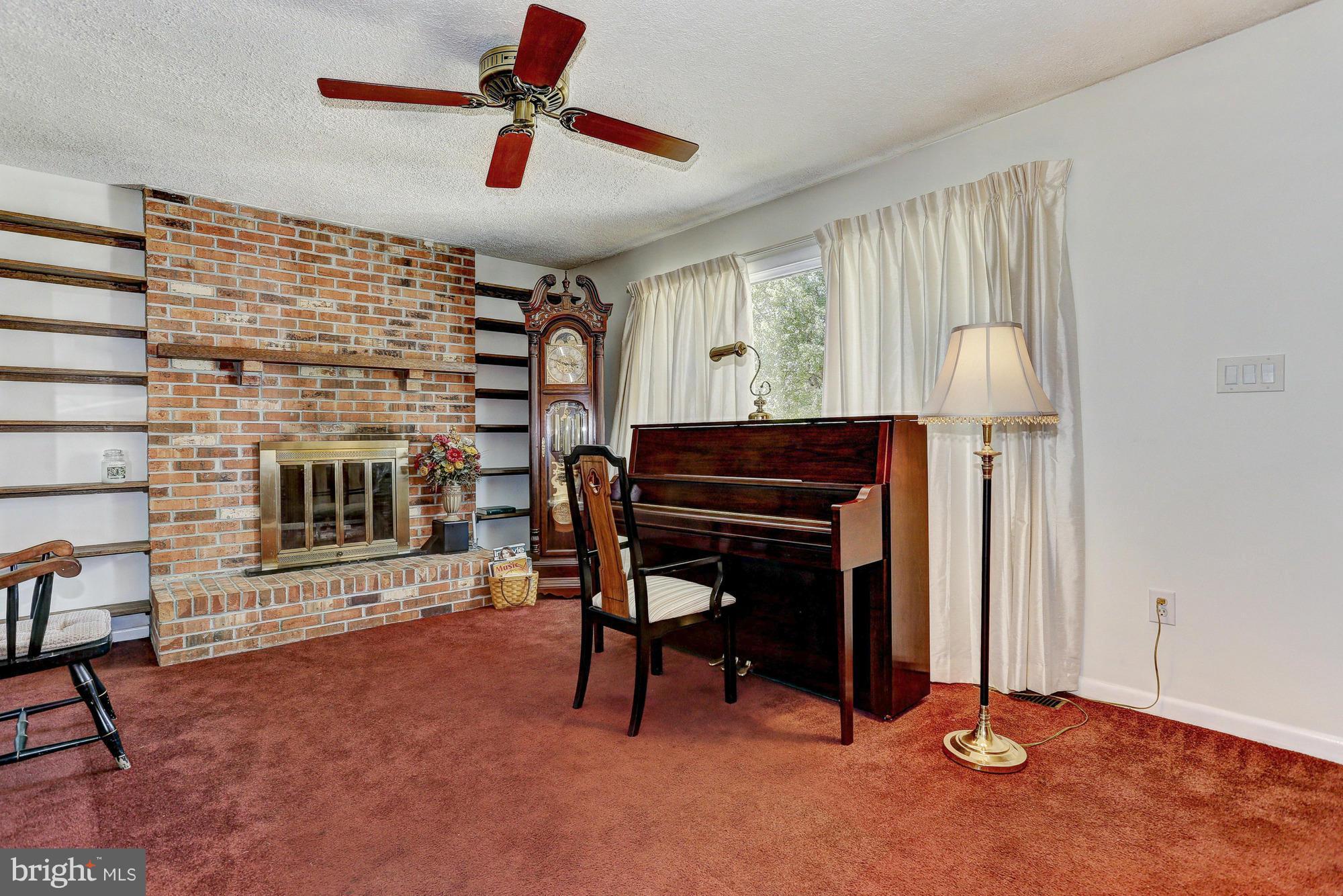 4149 Salem Bottom Road Westminster, MD 21157 - Photo 2 of 25 a view of a livingroom with furniture and a fireplace