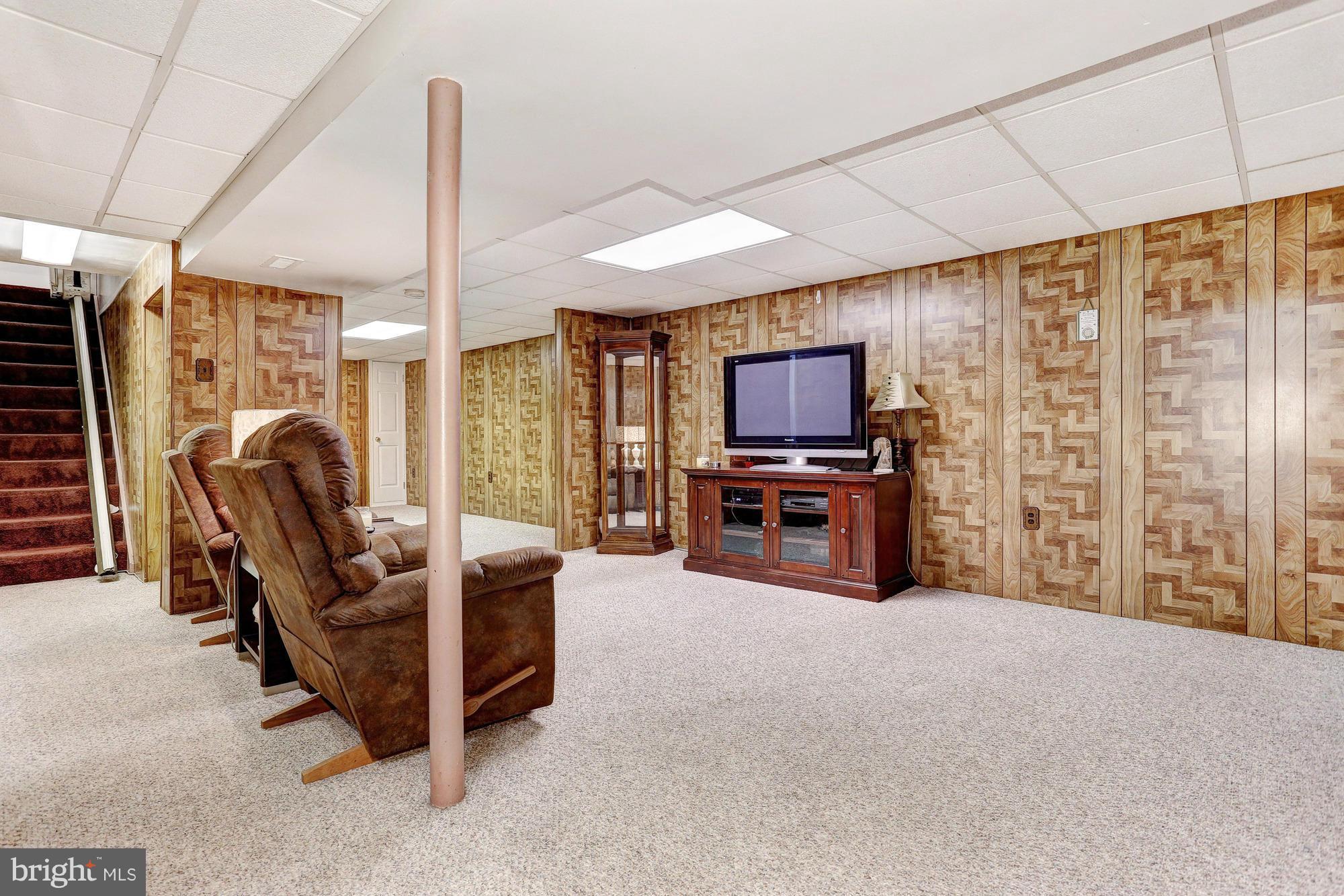 4149 Salem Bottom Road Westminster, MD 21157 - Photo 15 of 25 a living room with furniture and a flat screen tv