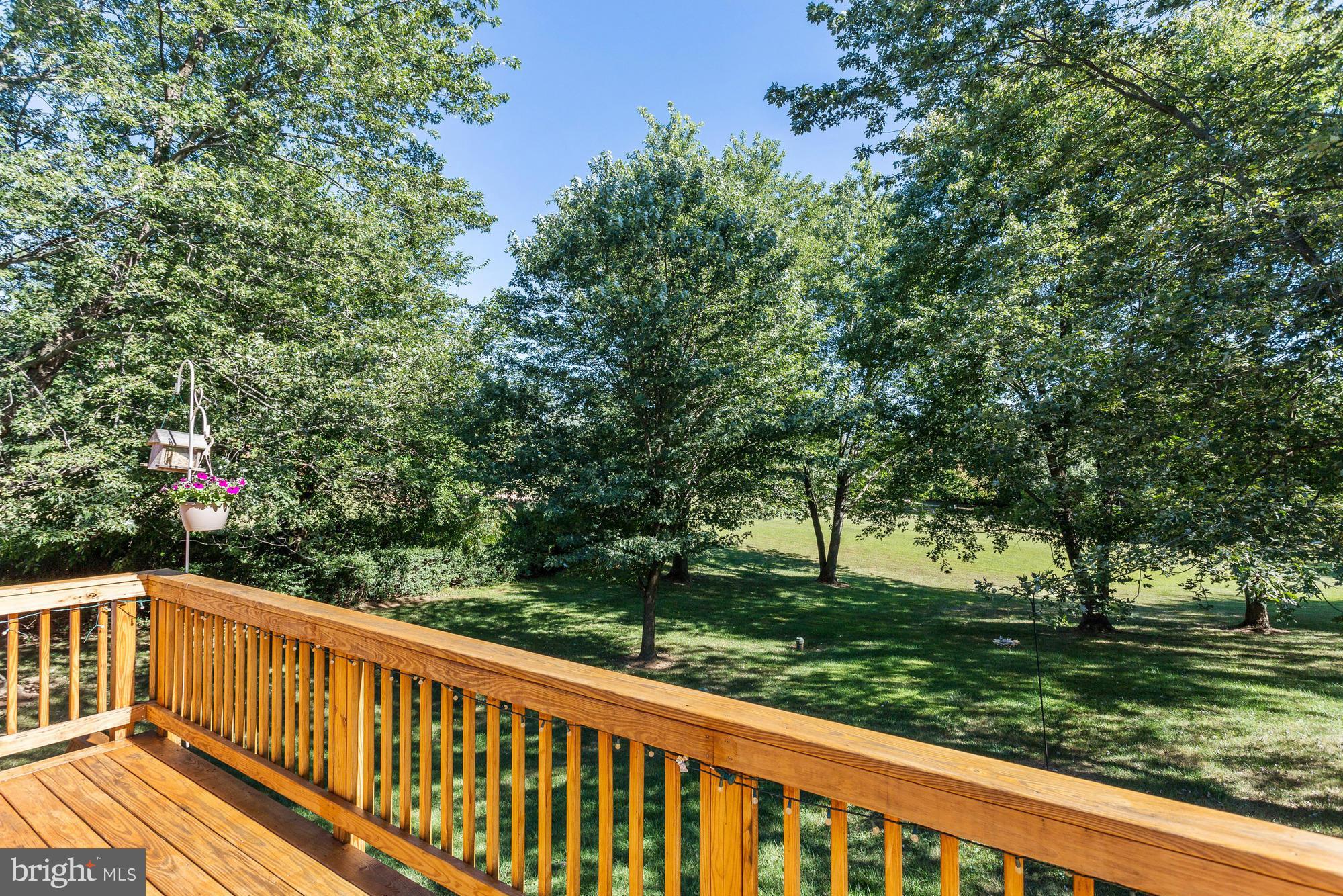 4149 Salem Bottom Road Westminster, MD 21157 - Photo 20 of 25 a view of a wooden deck next to a yard