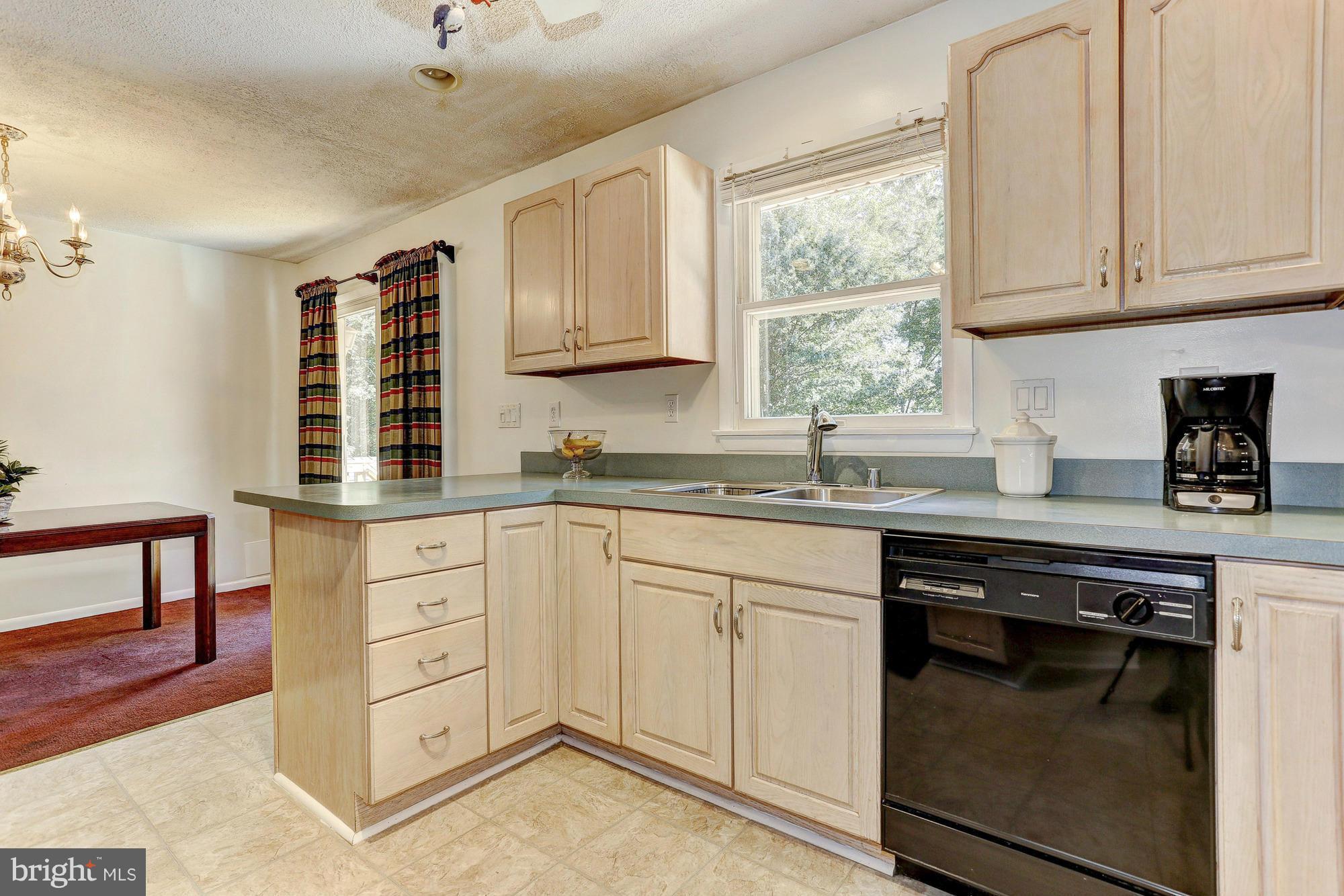 4149 Salem Bottom Road Westminster, MD 21157 - Photo 6 of 25 a kitchen with granite countertop white cabinets and window