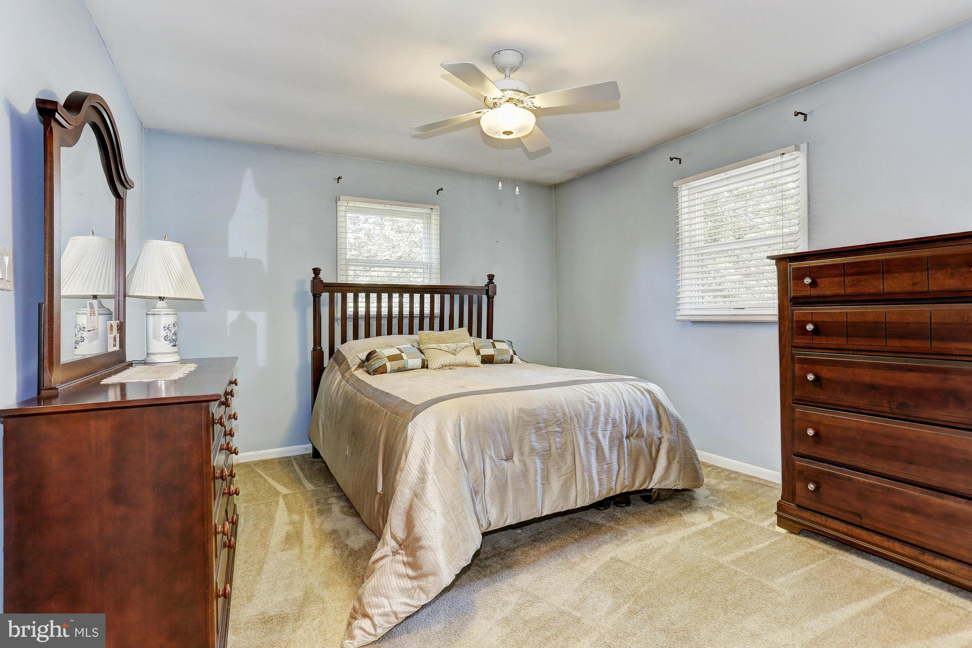 4149 Salem Bottom Road Westminster, MD 21157 - Photo 8 of 25 a bedroom with a bed and a chandelier