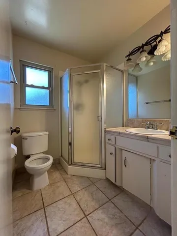 a view of a hallway with wooden shelves