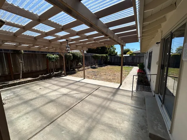 a view of a backyard with sitting area