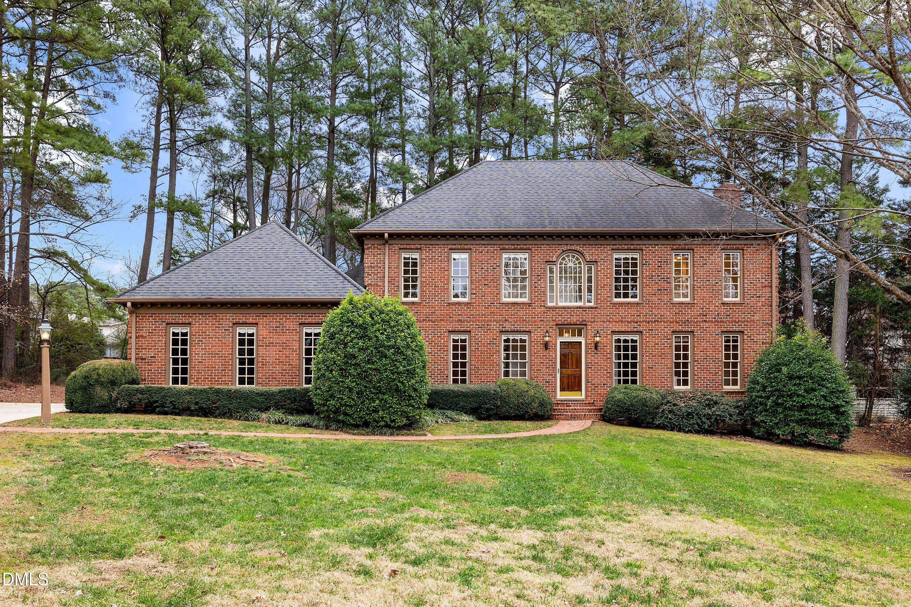 1708 Sawgrass Court Raleigh, NC 27615 - Photo 1 of 60 a front view of a house with a yard