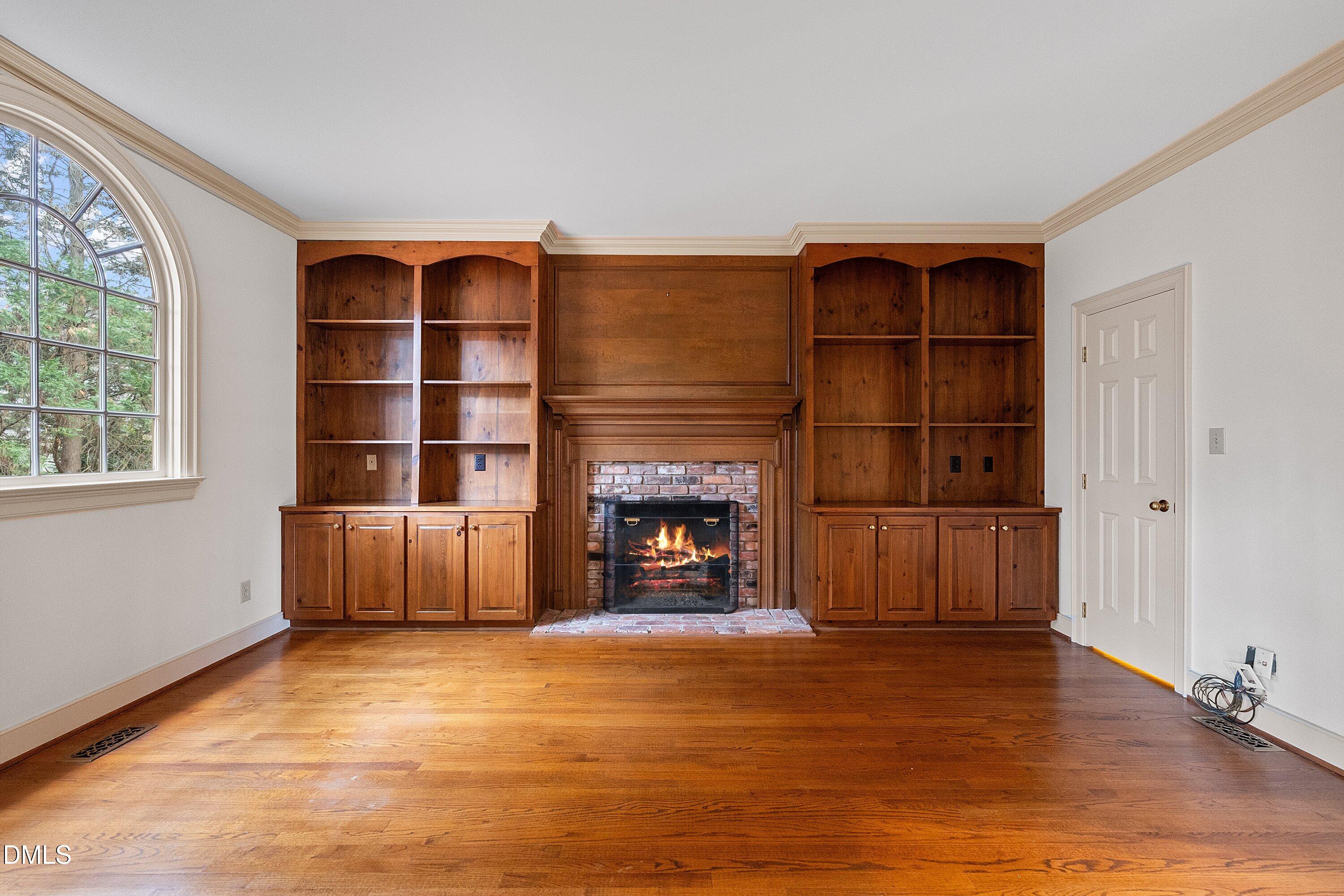 1708 Sawgrass Court Raleigh, NC 27615 - Photo 16 of 60 a living room with furniture window and fireplace