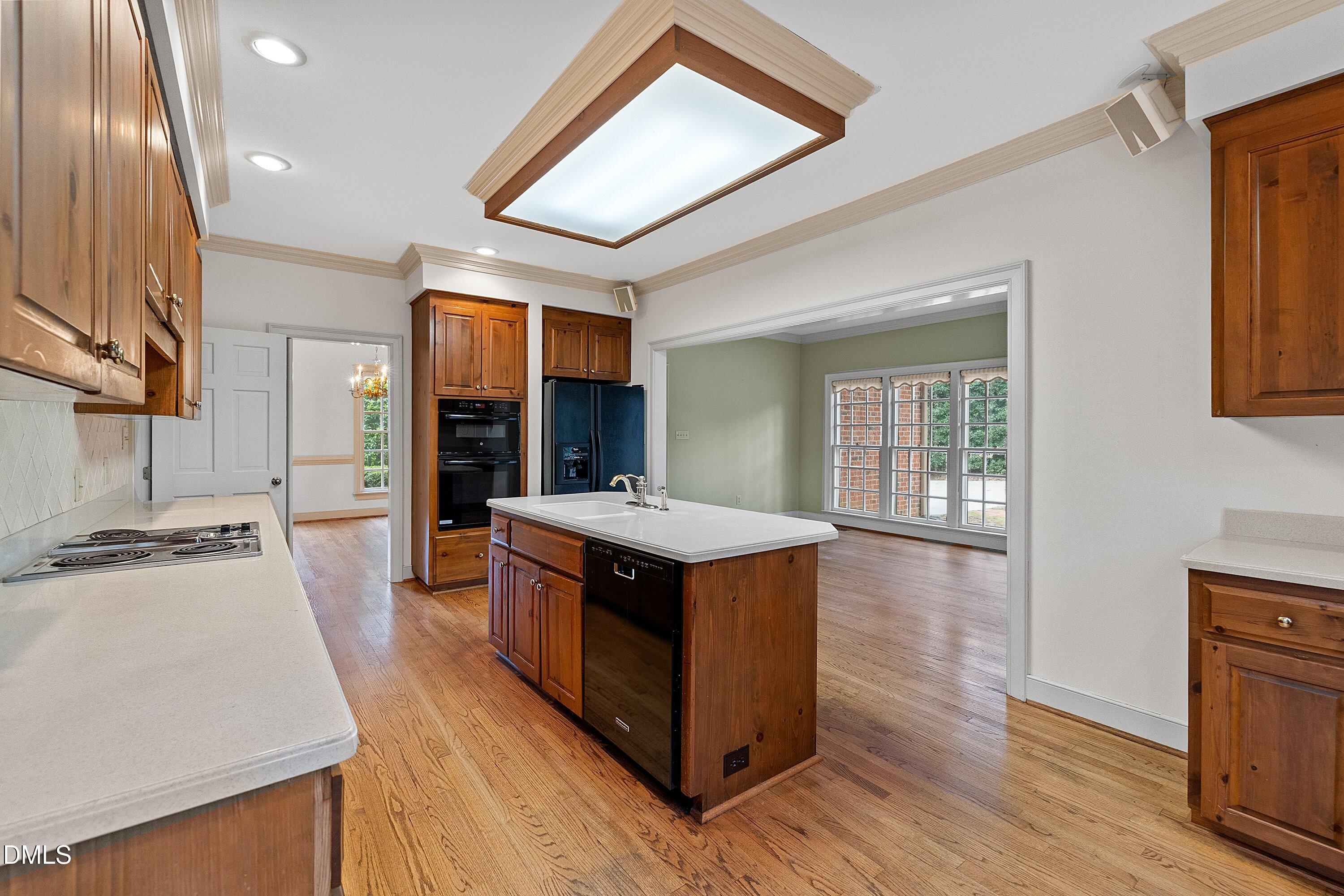 1708 Sawgrass Court Raleigh, NC 27615 - Photo 23 of 60 a kitchen with stainless steel appliances granite countertop a stove and a sink
