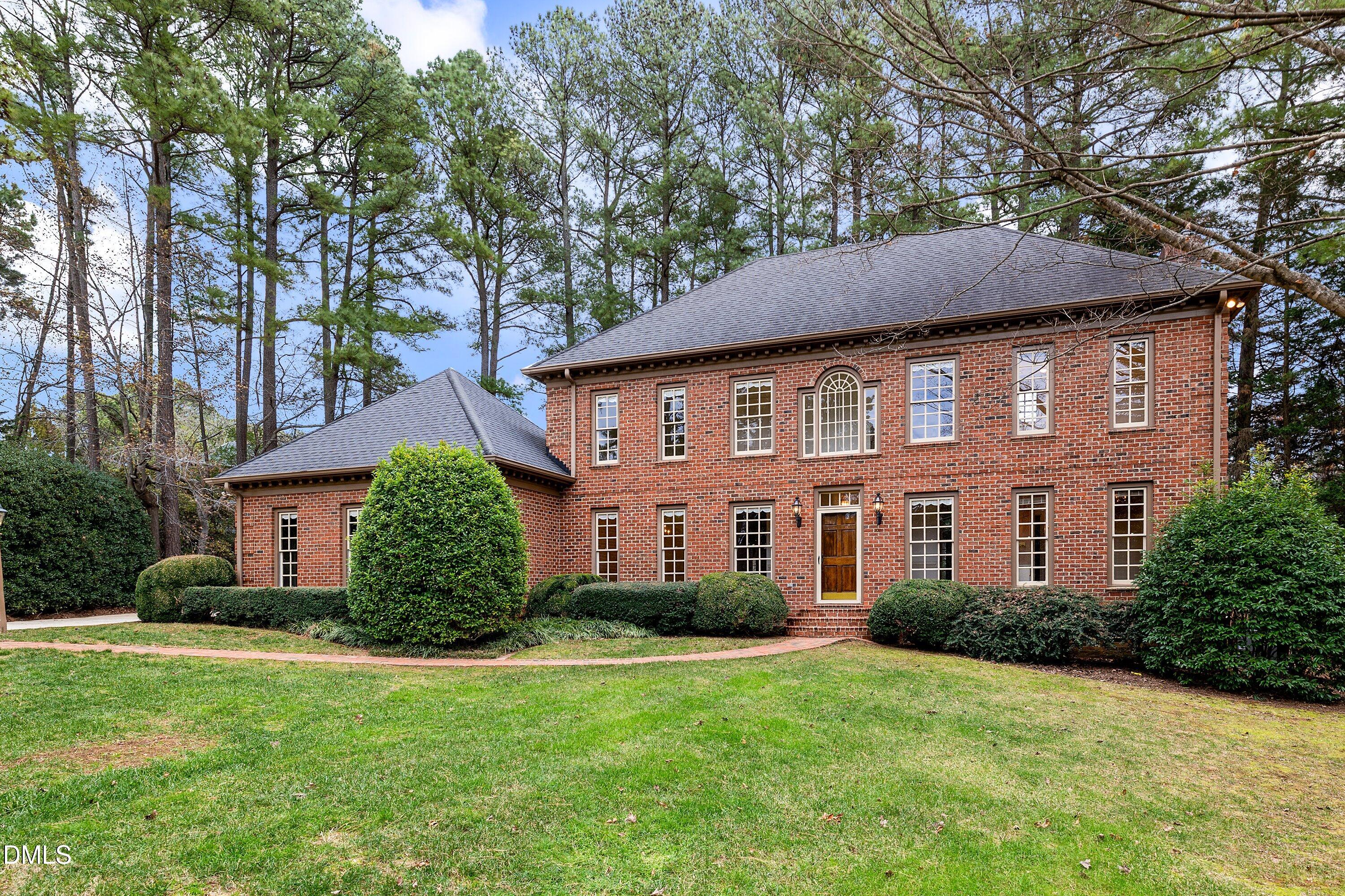 1708 Sawgrass Court Raleigh, NC 27615 - Photo 2 of 60 a front view of a house with garden