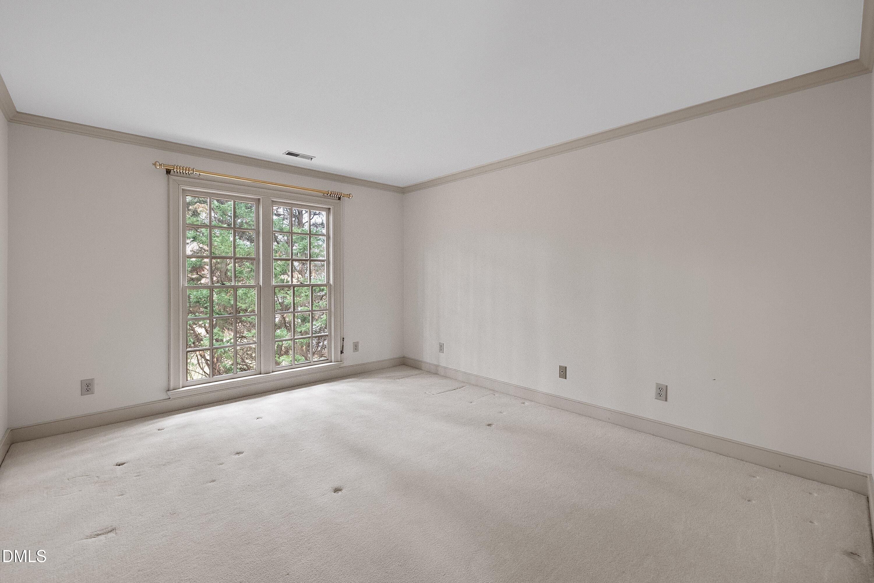 1708 Sawgrass Court Raleigh, NC 27615 - Photo 45 of 60 a view of an empty room with a window