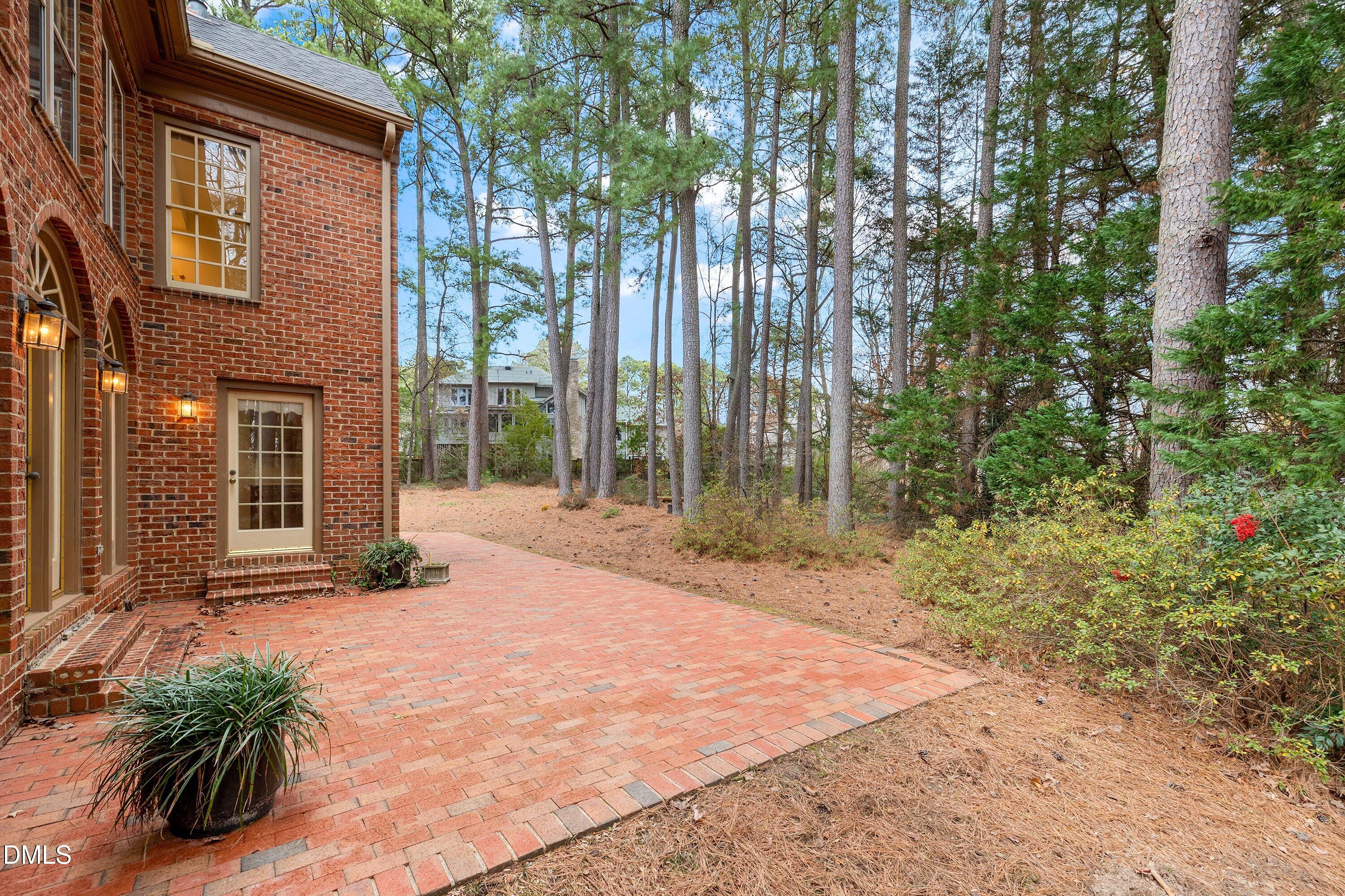 1708 Sawgrass Court Raleigh, NC 27615 - Photo 51 of 60 a front view of a house with a yard