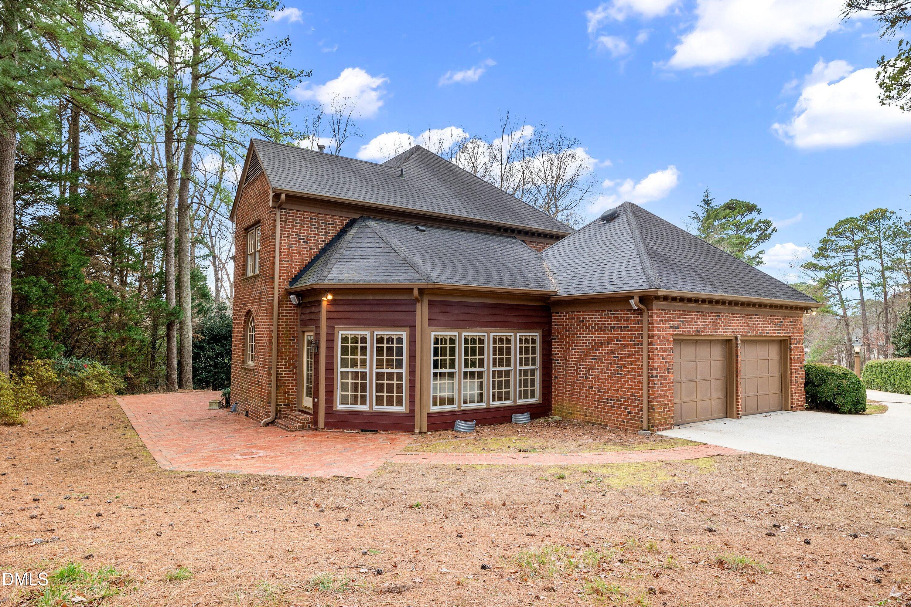 1708 Sawgrass Court Raleigh, NC 27615 - Photo 52 of 60 a view of a house with a yard and garage