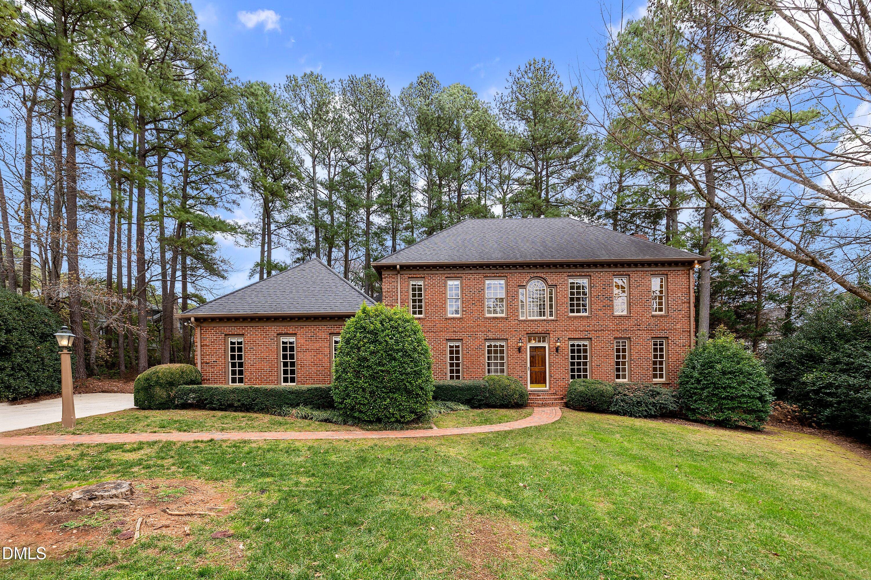 1708 Sawgrass Court Raleigh, NC 27615 - Photo 59 of 60 a front view of a house with a yard
