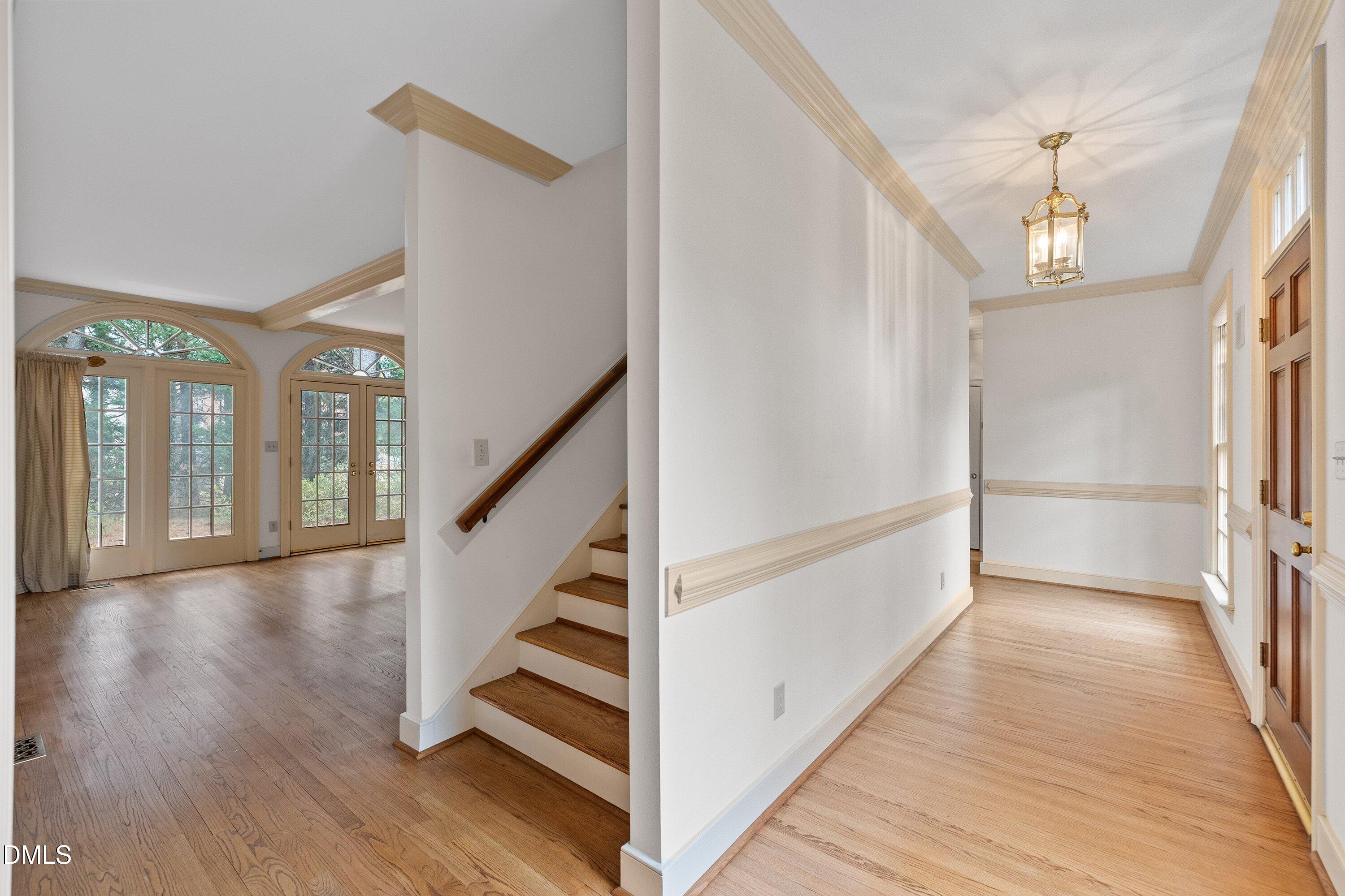 1708 Sawgrass Court Raleigh, NC 27615 - Photo 7 of 60 a view of entryway and hall with wooden floor