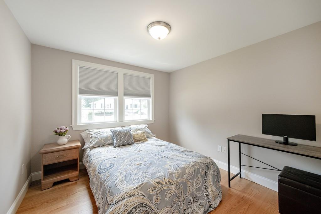7 Peter Road North Reading, MA 01864 - Photo 15 of 32 a bedroom with a bed and a flat screen tv