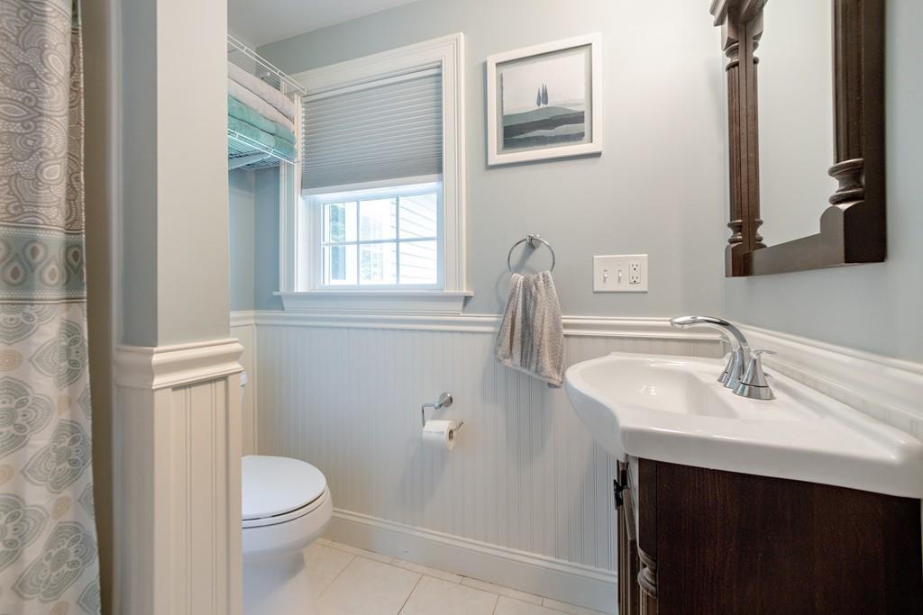 7 Peter Road North Reading, MA 01864 - Photo 16 of 32 a bathroom with a sink a toilet and a mirror