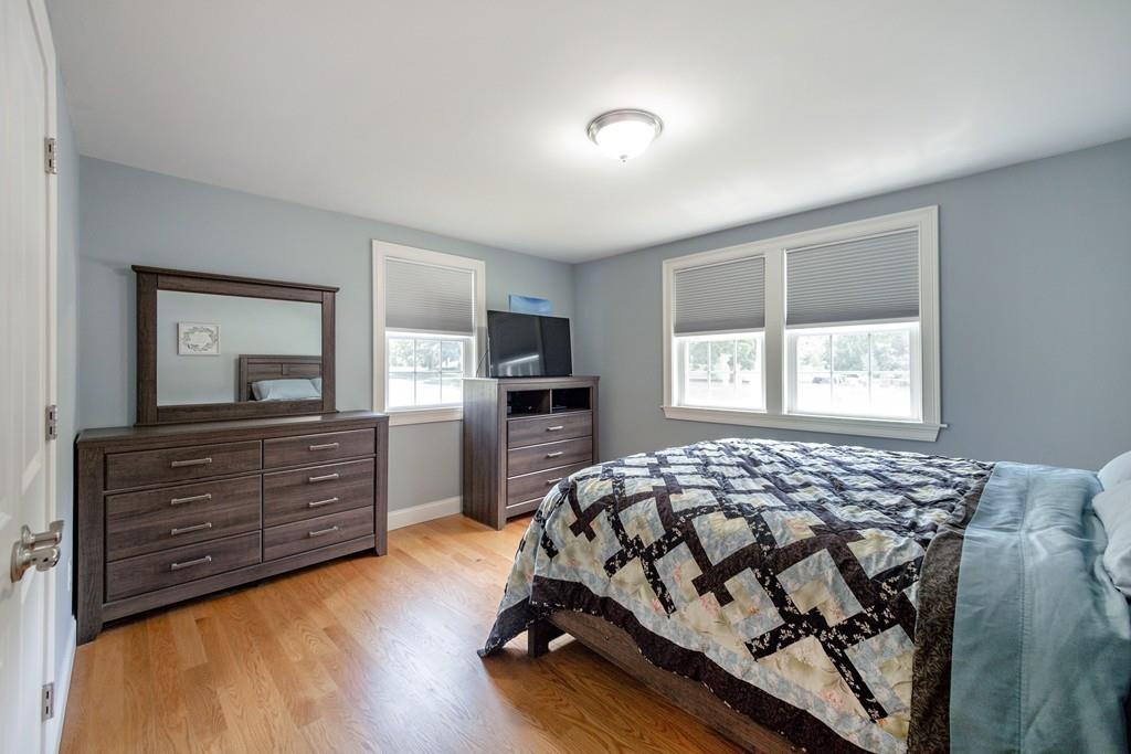7 Peter Road North Reading, MA 01864 - Photo 17 of 32 a bedroom with a bed and a dresser