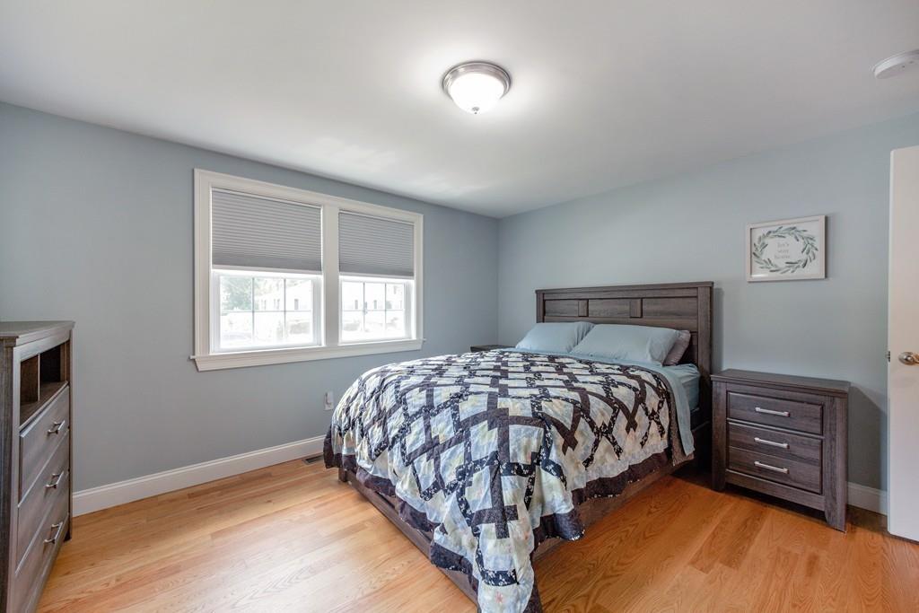 7 Peter Road North Reading, MA 01864 - Photo 18 of 32 a bedroom with a bed and a tv