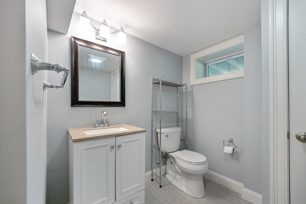 7 Peter Road North Reading, MA 01864 - Photo 22 of 32 a bathroom with a toilet a sink and mirror