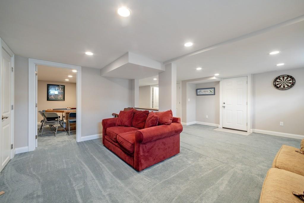 7 Peter Road North Reading, MA 01864 - Photo 27 of 32 a living room with furniture and a window