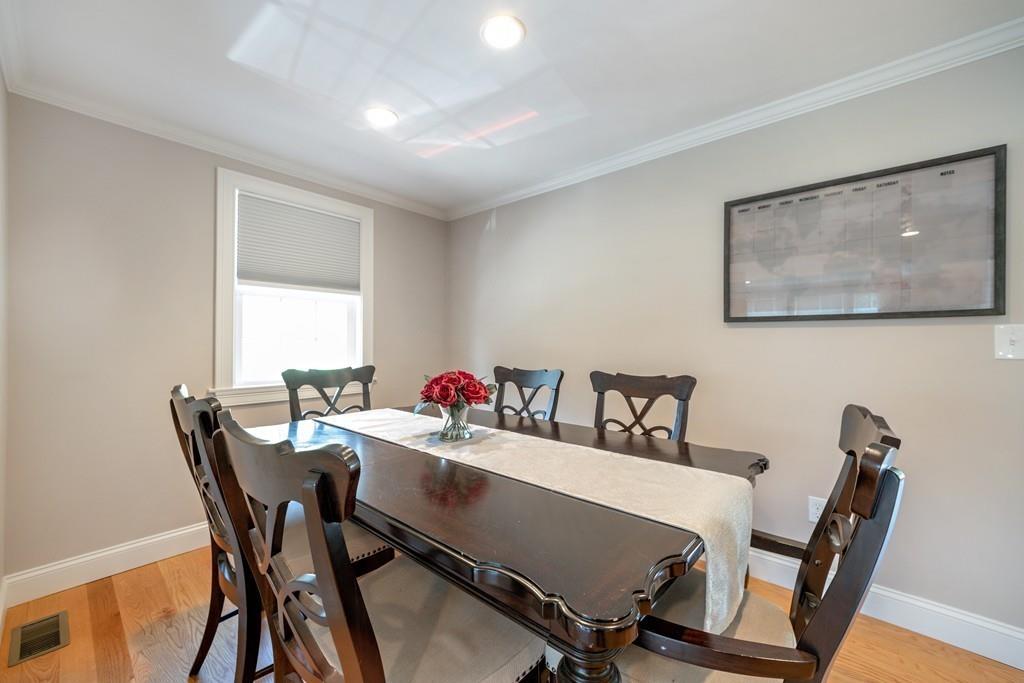 7 Peter Road North Reading, MA 01864 - Photo 9 of 32 a view of a dining room with a table and chairs