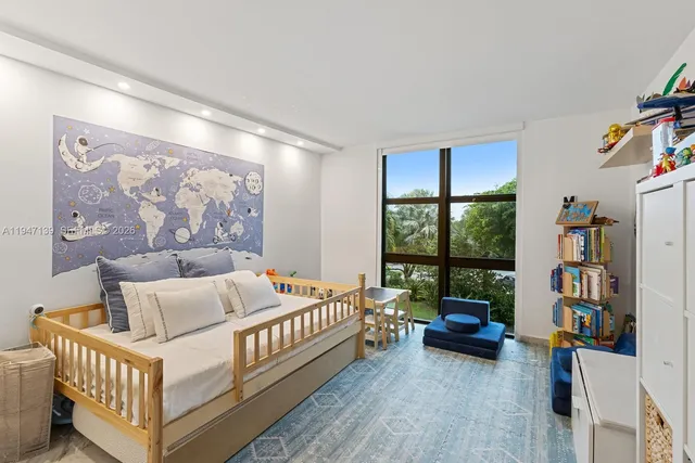 a bed room with furniture and a window