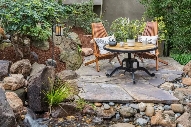 a large kitchen with granite countertop a large window and a counter space