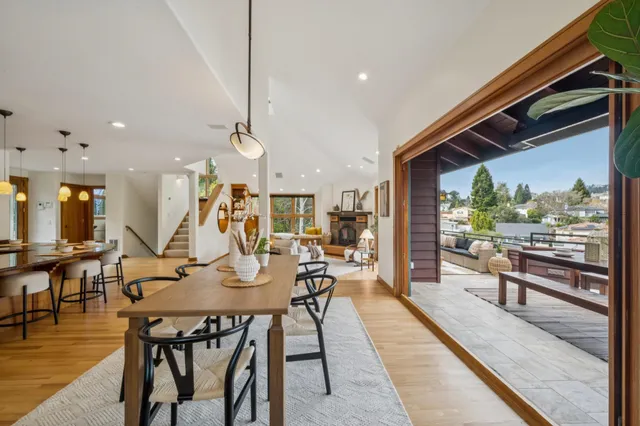 a view of roof deck with couches and city view