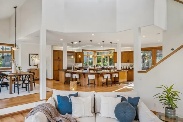 a bathroom with a granite countertop sink mirror and a bath tub