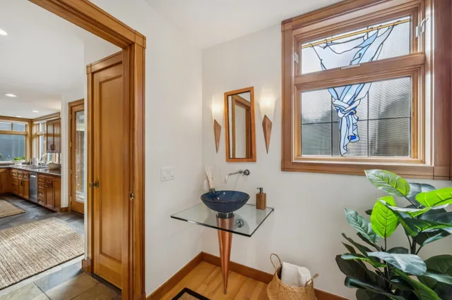 a large bathroom with a double vanity sink a mirror and a shower