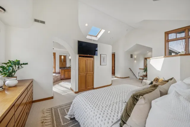 a view of a balcony with two chairs and wooden floor