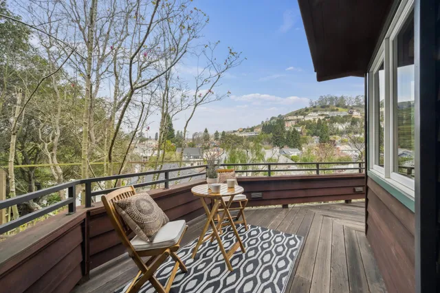 a view of a patio with furniture and a yard