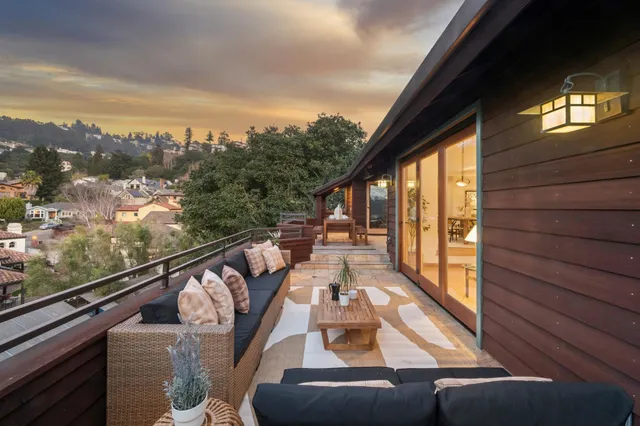 a view of balcony with furniture