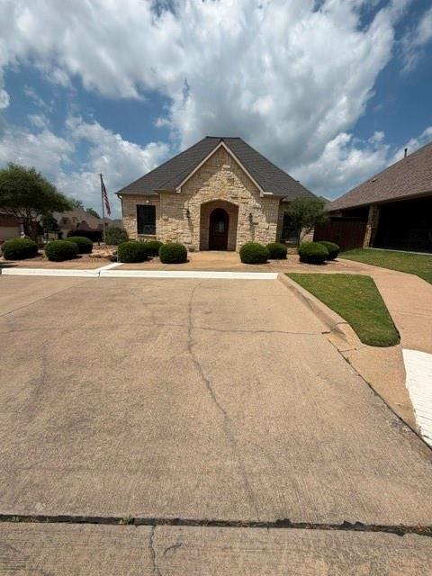 202 Tower Circle Terrell, TX 75160 - Photo 6 of 39 a house with trees in the background